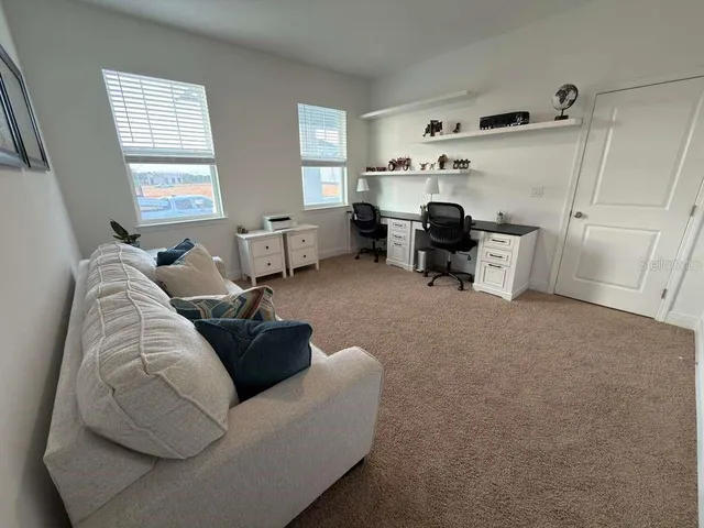 a living room with furniture and window