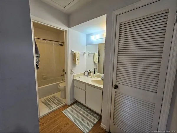 a bathroom with a shower and a sink