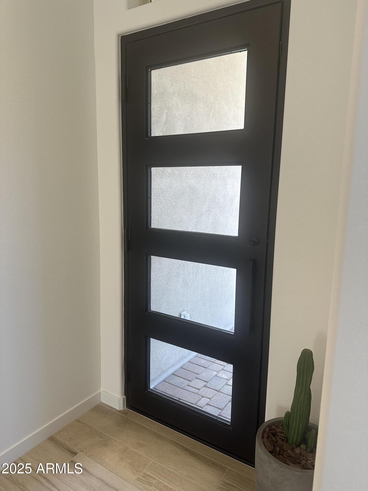 3638 East Roland Street Mesa, AZ 85213 - Photo 4 of 37 Lot 27 Iron front door inside