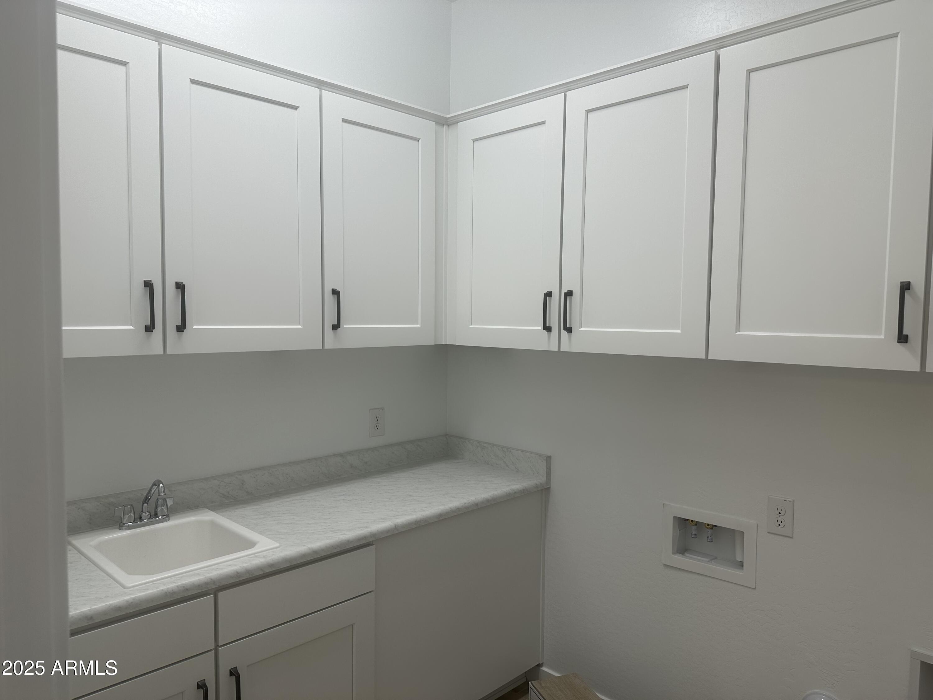 3638 East Roland Street Mesa, AZ 85213 - Photo 9 of 37 lot 27 Utility Room with lots of cabinet