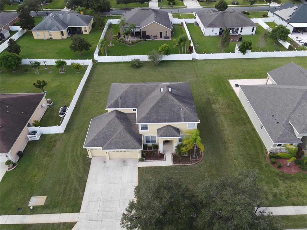 3145 Twisted Oak Loop Kissimmee, FL 34744 - Photo 90 of 93 an aerial view of house with a yard