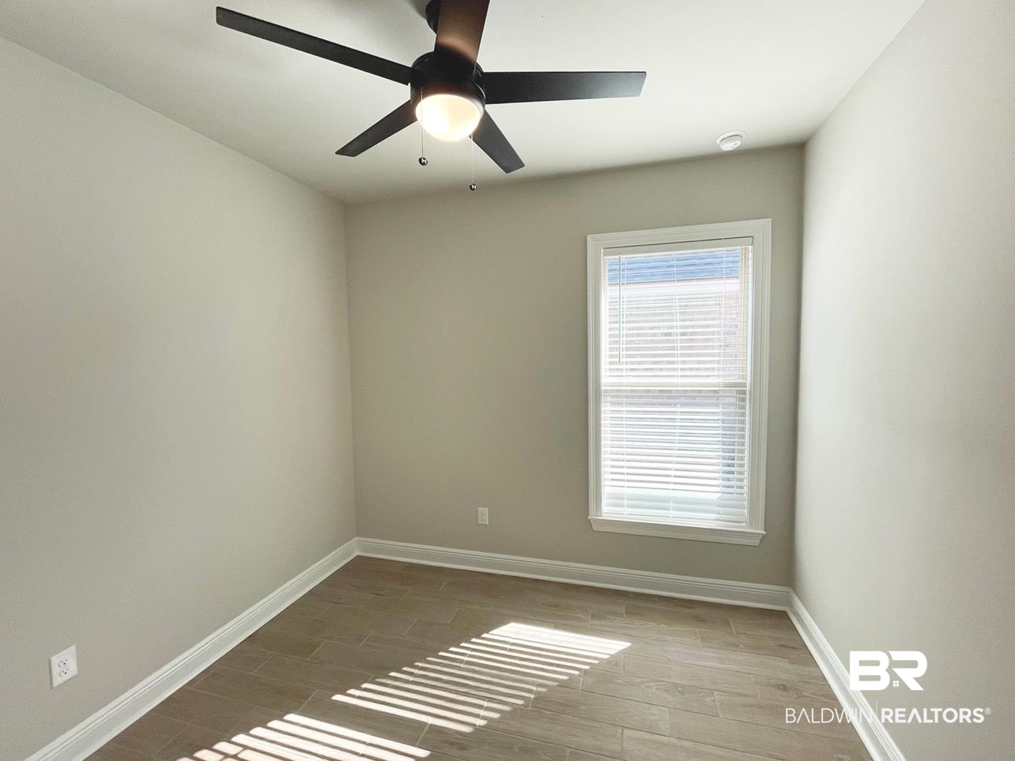 1579 Fenton Circle Foley, AL 36535 - Photo 9 of 14 Empty room featuring hardwood / wood-style floors and ceiling fan