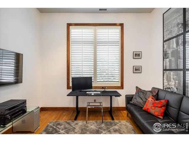 a workspace with furniture and a window