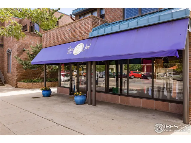 a view of a cafe with sitting area
