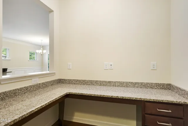a bathroom with a granite countertop sink double vanity and a mirror
