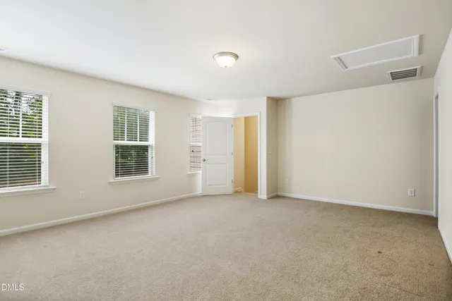 a view of a balcony with wooden floor