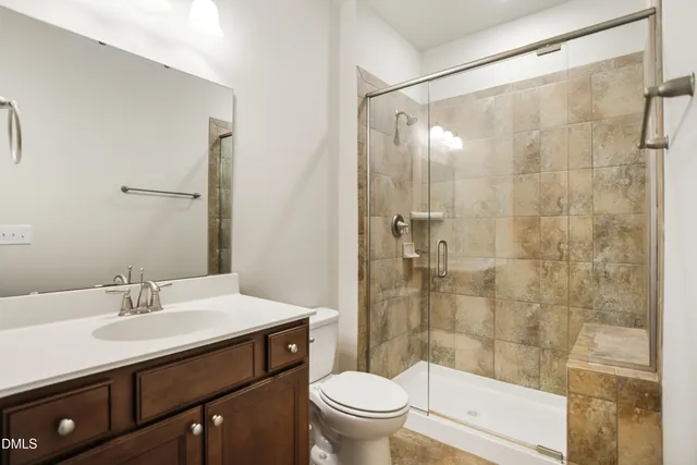 an aerial view of a house with a yard basket ball court and outdoor seating