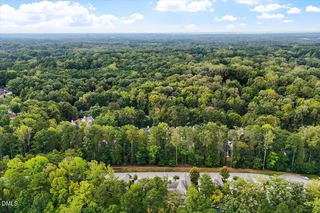 a view of a porch with furniture and wooden fence