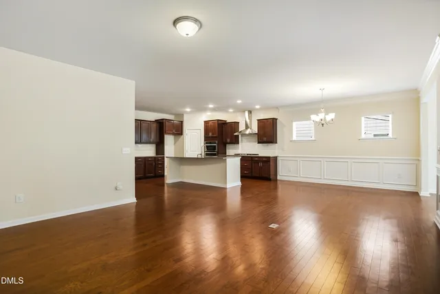 a kitchen with stainless steel appliances granite countertop wooden cabinets and a counter top space