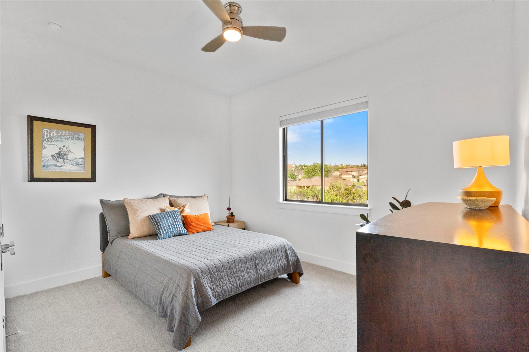2050 Lohmans Spur Road, Unit 1302 Lakeway, TX 78734 - Photo 12 of 18 a bedroom with a bed and wooden floor
