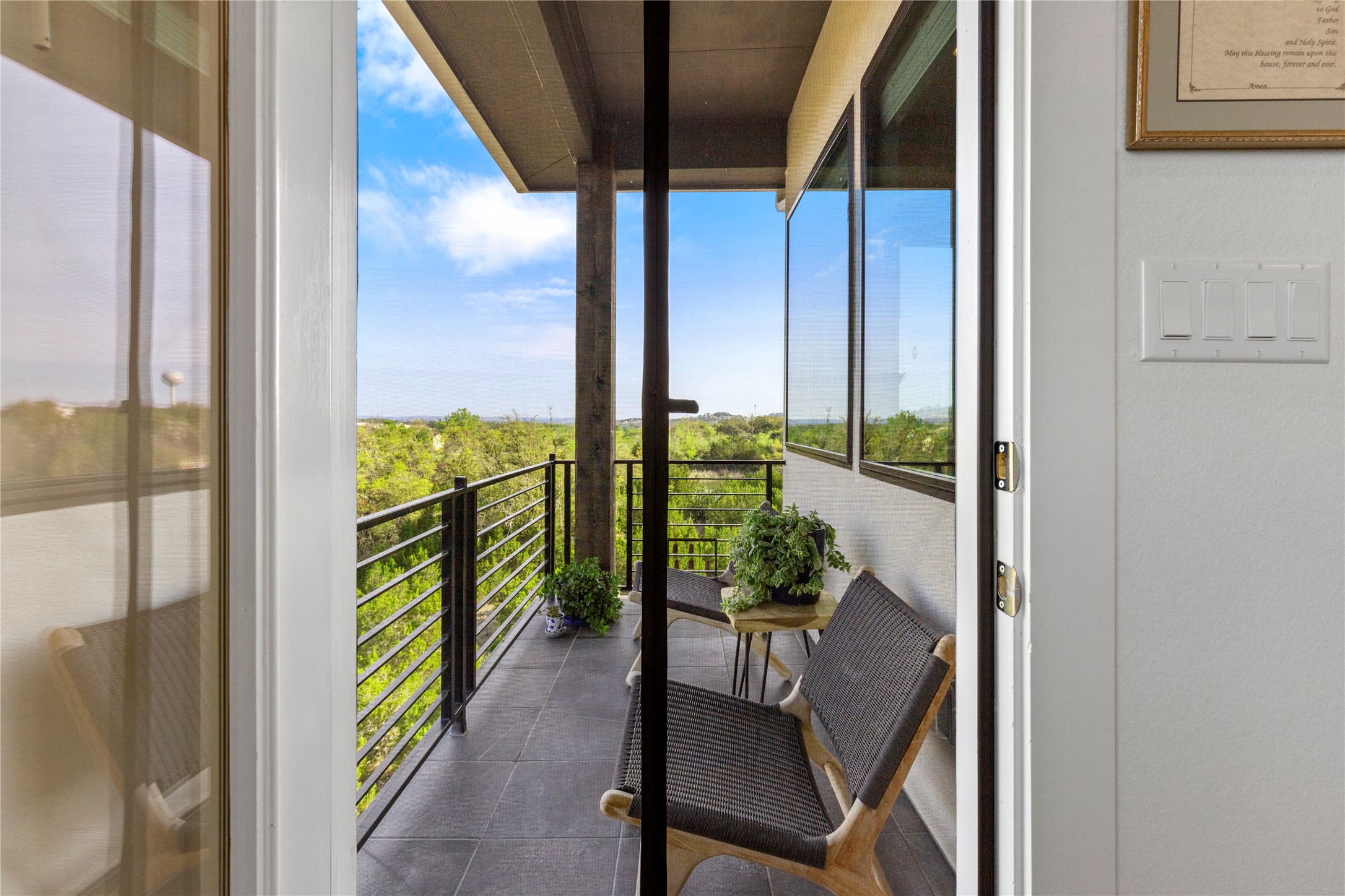 2050 Lohmans Spur Road, Unit 1302 Lakeway, TX 78734 - Photo 6 of 18 a balcony with chairs and potted plants