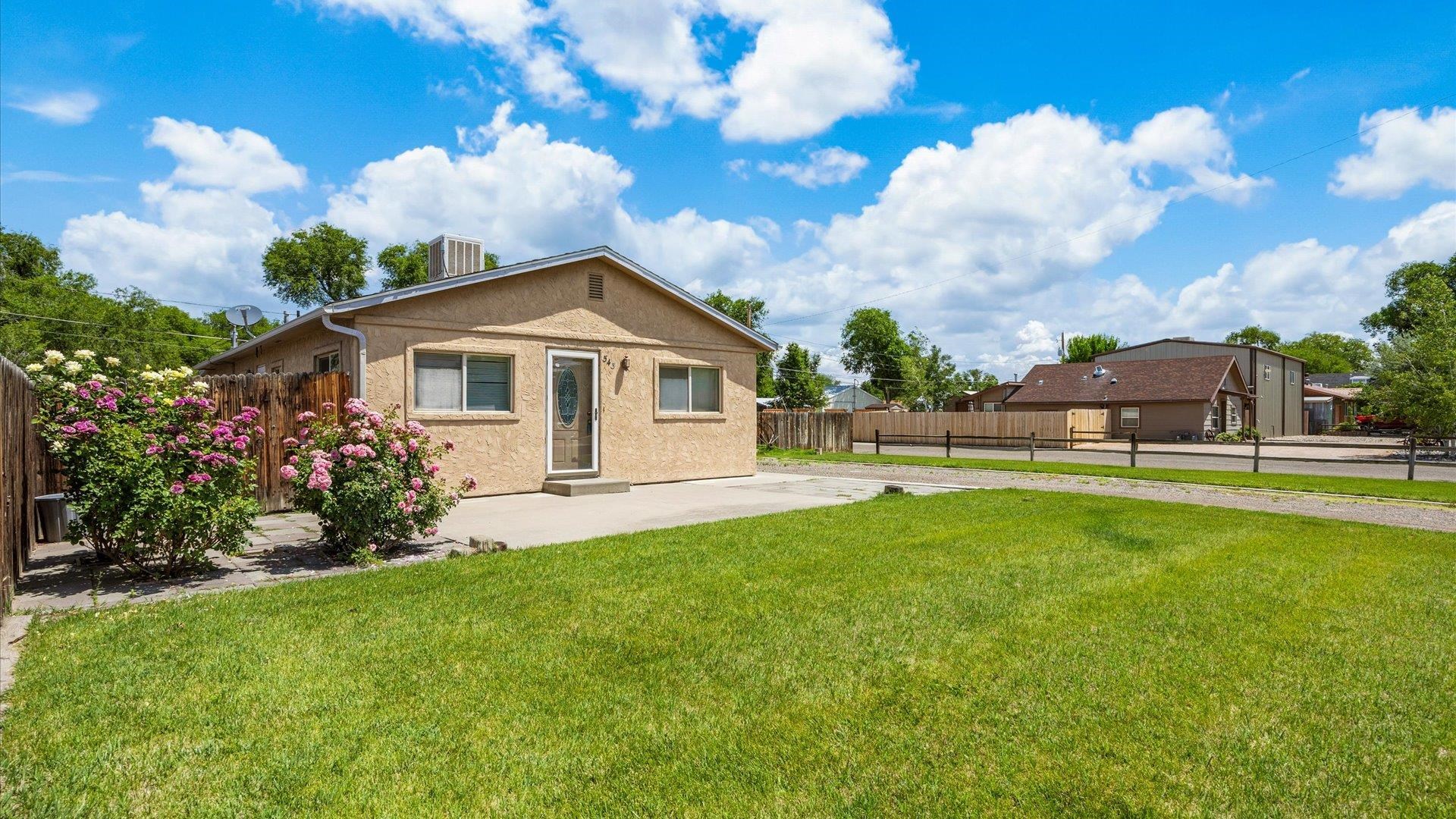 543 East Harrison Avenue Fruita, CO 81521 - Photo 2 of 25 a view of a house with a backyard