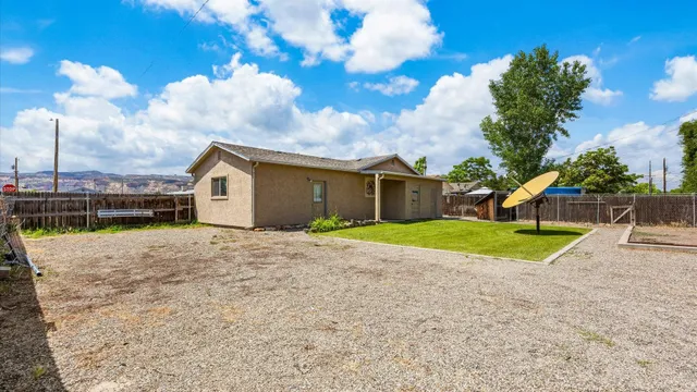 a view of a swimming pool with lounge chairs in patio