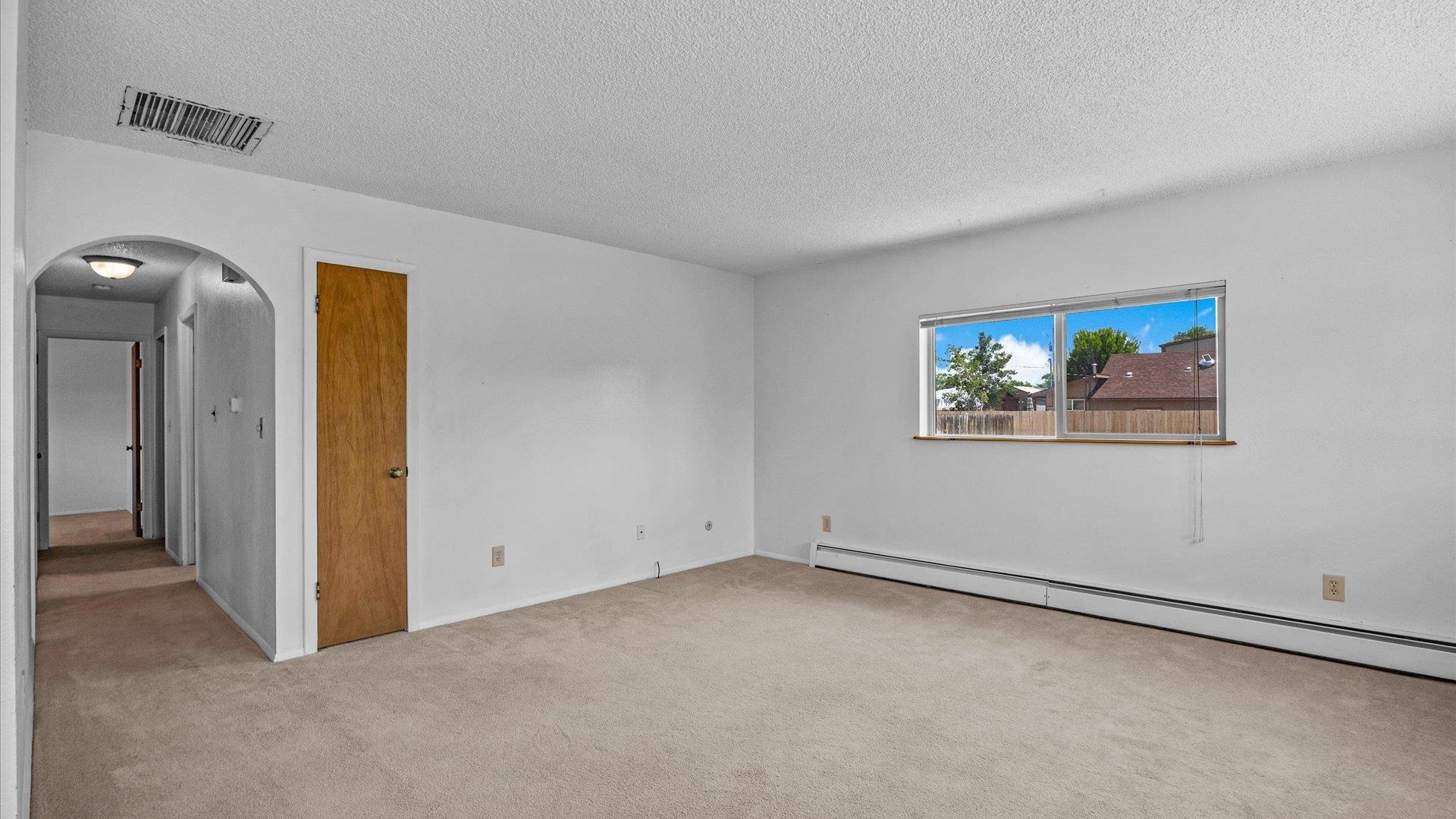 543 East Harrison Avenue Fruita, CO 81521 - Photo 7 of 25 an empty room with windows