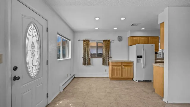a view of an entryway with wooden floor