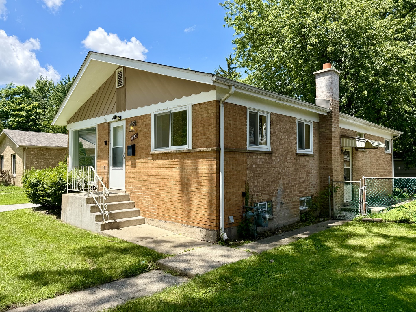 1820 169th Street Hazel Crest, IL 60429 - Photo 4 of 23 a view of a house with a yard
