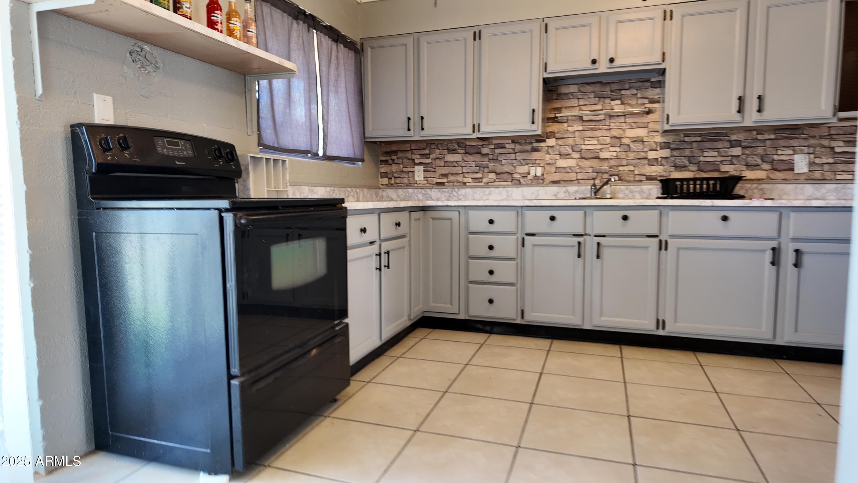 336 Greenwich Road Kearny, AZ 85137 - Photo 1 of 37 a kitchen with stainless steel appliances a sink cabinets and a counter top space