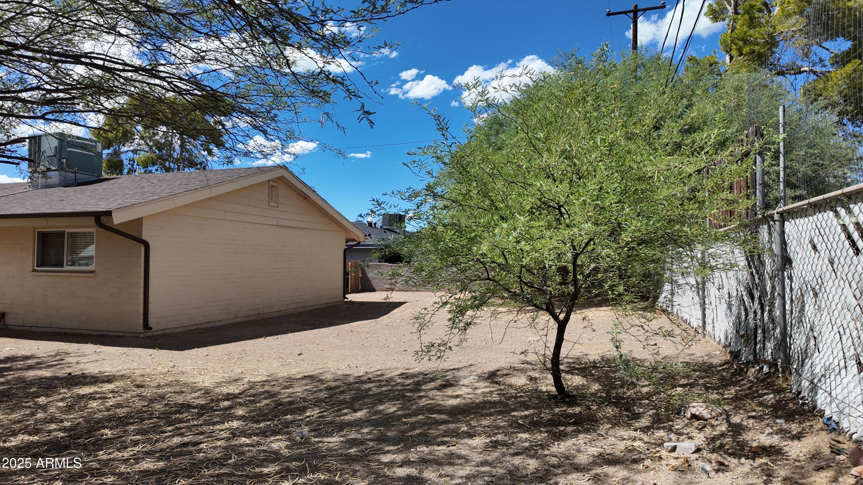 336 Greenwich Road Kearny, AZ 85137 - Photo 26 of 37 a view of a house with a yard tree