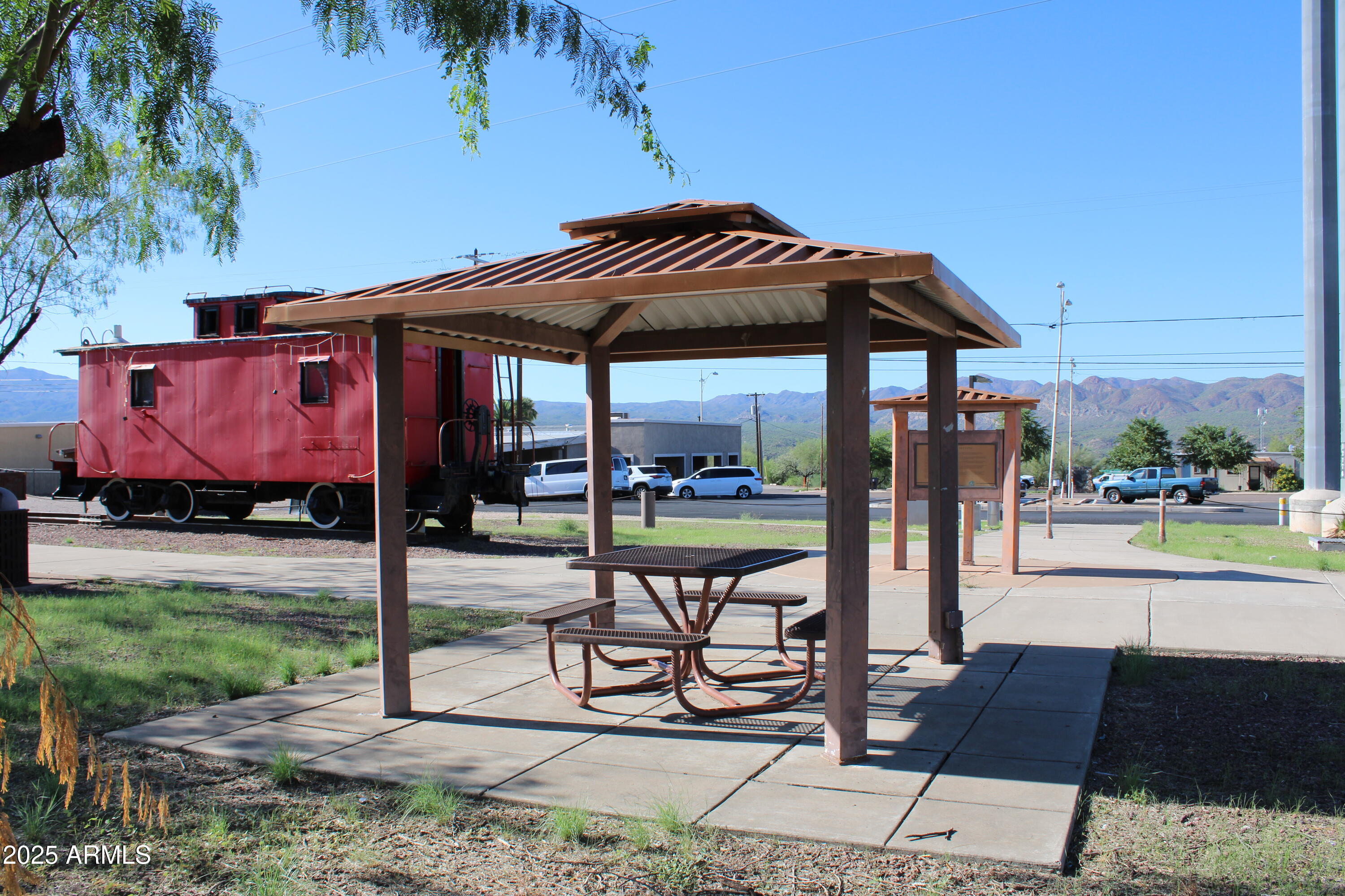 336 Greenwich Road Kearny, AZ 85137 - Photo 34 of 37 a view of a patio with a table and chairs under an umbrella