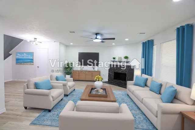 a living room with furniture and a fireplace