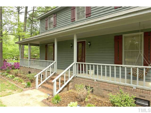 1012 Ridge Drive Clayton, NC 27520 - Photo 2 of 14 Huge Rocking Chair Front Porch even wraps around side! Porch