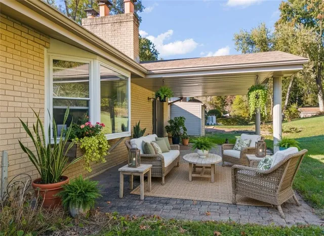 a view of a patio with couches chairs and a table and chairs