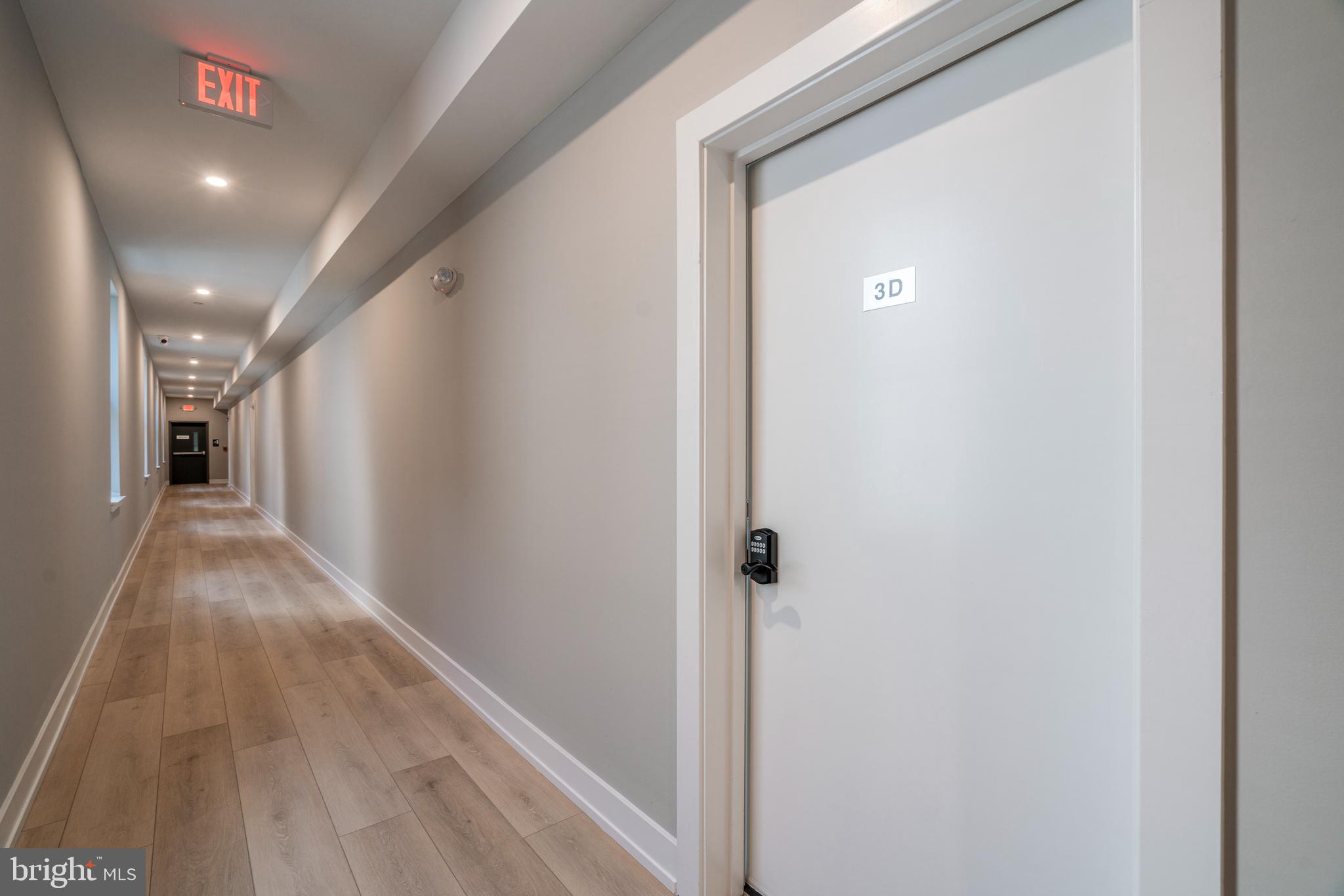 2401 Washington Avenue, Unit 3D Philadelphia, PA 19146 - Photo 9 of 18 a view of a hallway with wooden floor