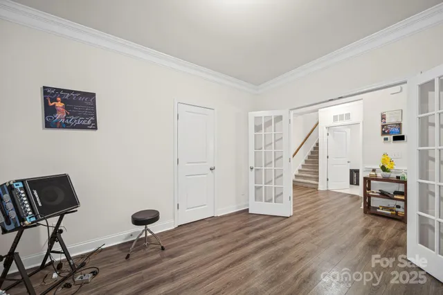 a view of a livingroom with furniture and staircase