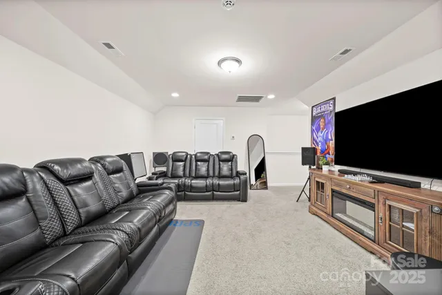 a bathroom with a sink vanity mirror and toilet