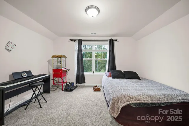 a bedroom with a bed and a cabinets