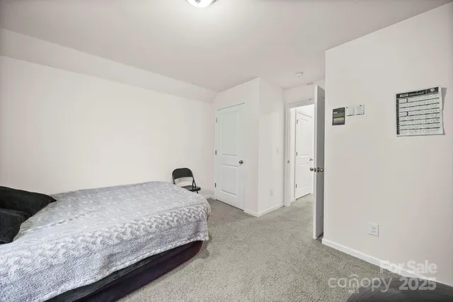 a view of a field with trees in the background