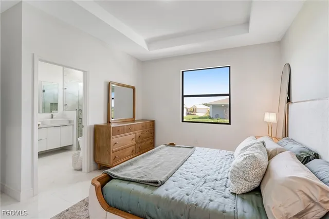 a bedroom with a bed and dresser