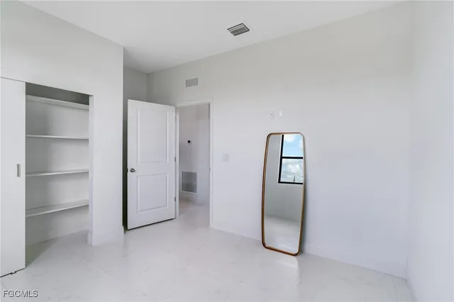 a room with a door and closet