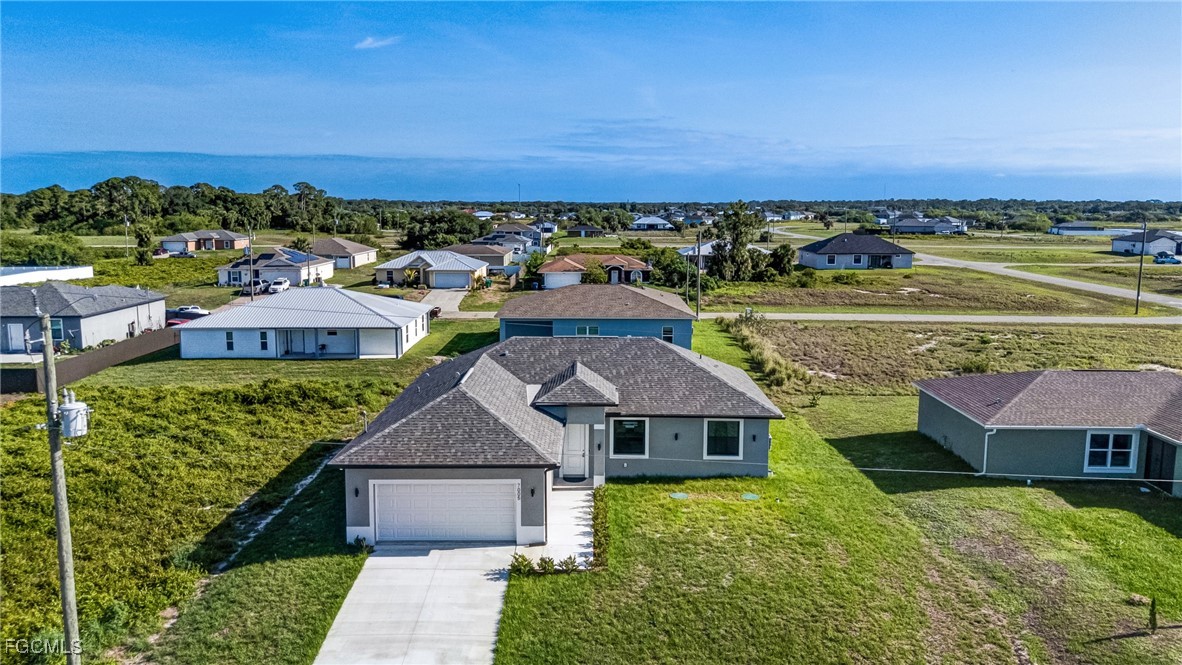 9018 West Castle Circle LaBelle, FL 33935 - Photo 2 of 27 a aerial view of a house with a garden