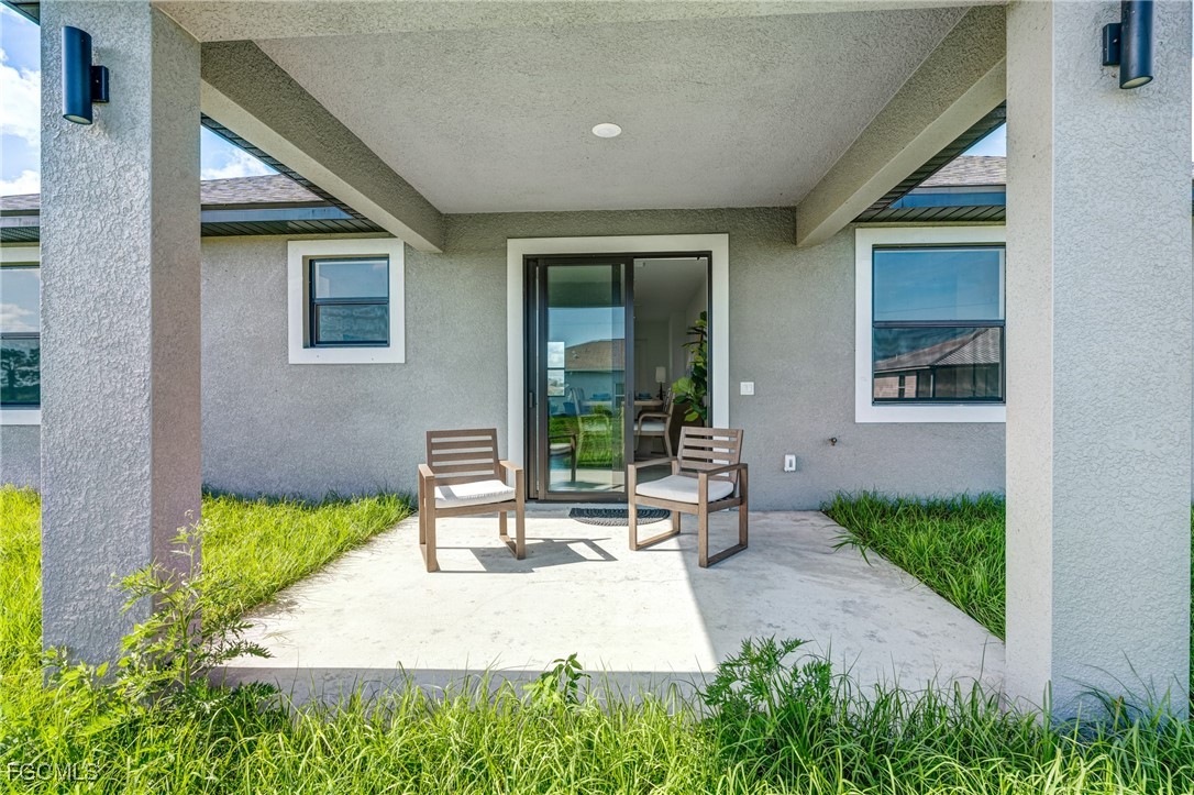 9018 West Castle Circle LaBelle, FL 33935 - Photo 22 of 27 a front view of a house with garden