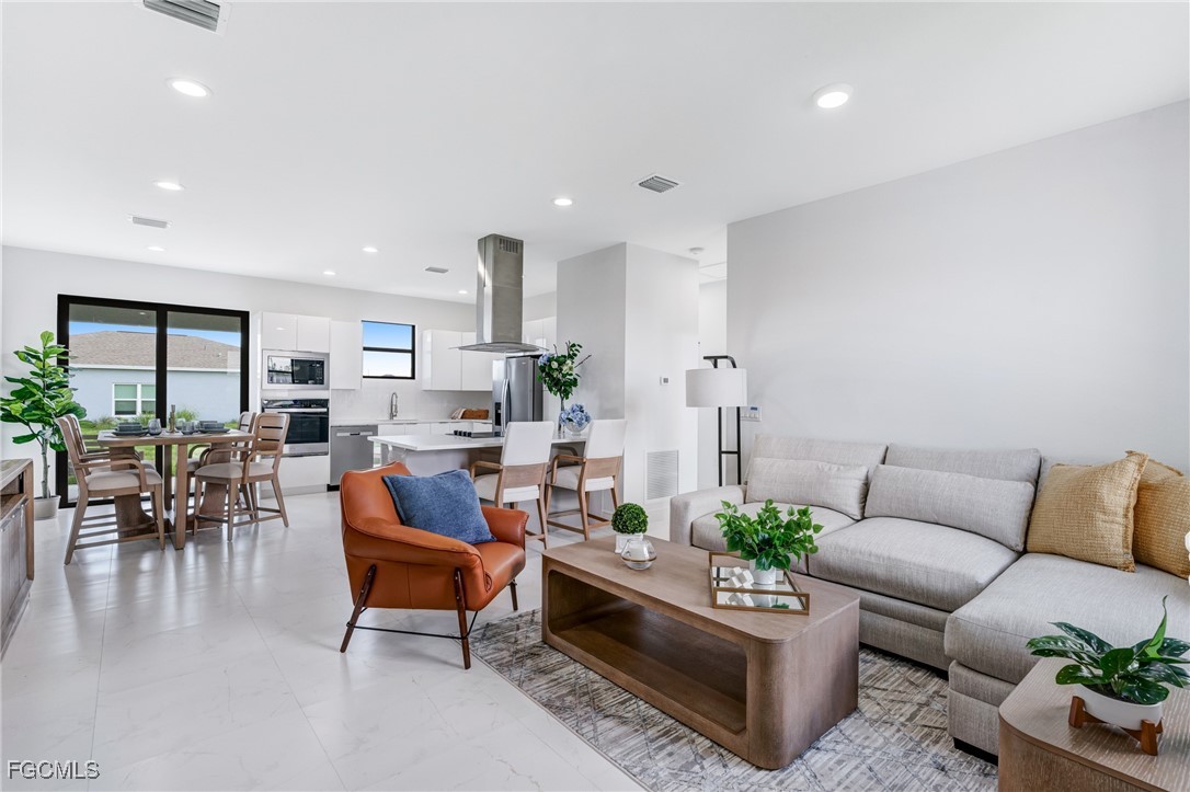 9018 West Castle Circle LaBelle, FL 33935 - Photo 5 of 27 a living room with furniture and a large window