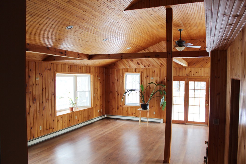 39 Winchendon Road Ashburnham, MA 01430 - Photo 3 of 14 a view of an empty room with wooden floor and a window