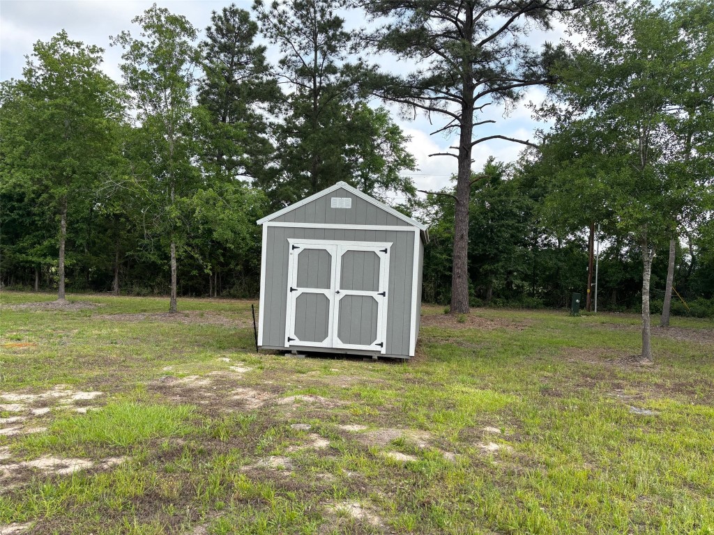 207 George Wilson Road Huntsville, TX 77320 - Photo 25 of 26 a view of a house with a yard