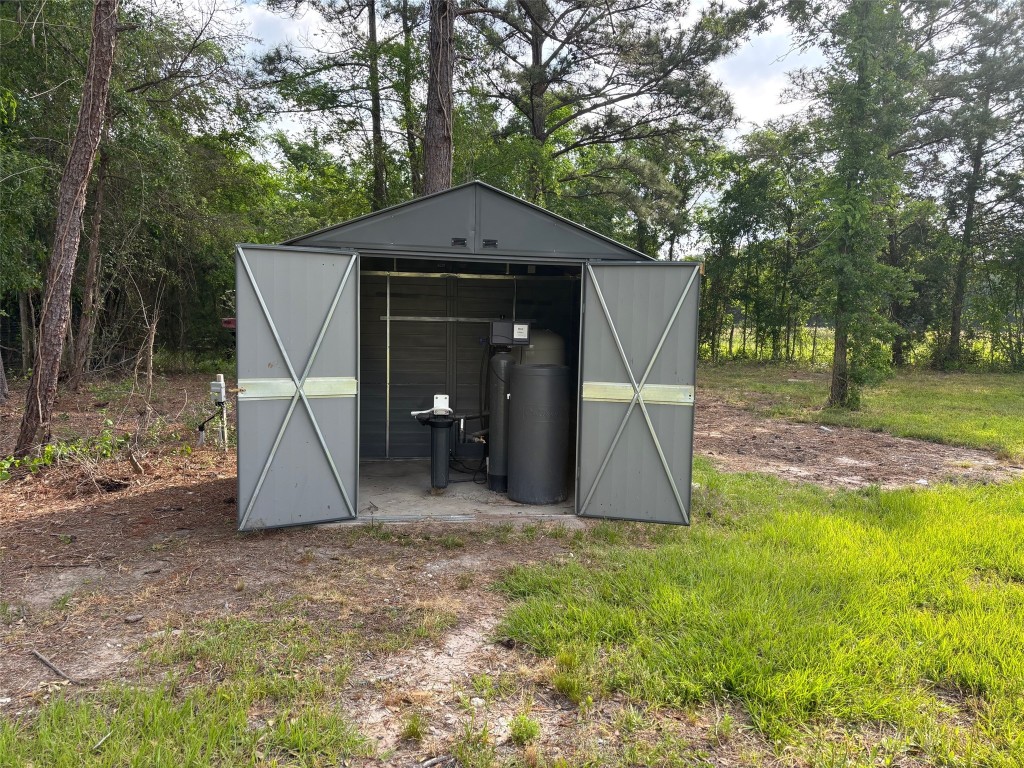 207 George Wilson Road Huntsville, TX 77320 - Photo 26 of 26 a view of a small house with a entertaining space