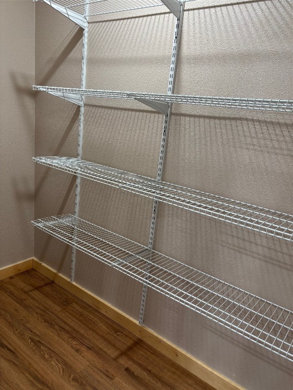 207 George Wilson Road Huntsville, TX 77320 - Photo 10 of 26 a view of a room with wooden floor