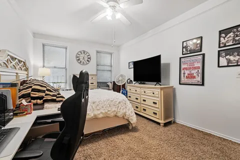 a view of a livingroom with furniture and a flat screen tv