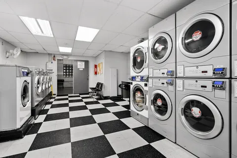 a view of a storage and utility room with washer and dryer