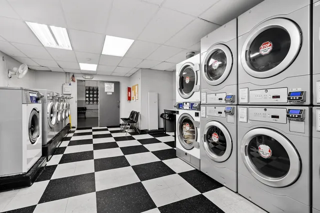 a view of a storage and utility room with washer and dryer