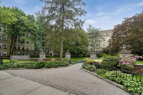 a view of a house with a yard and plants