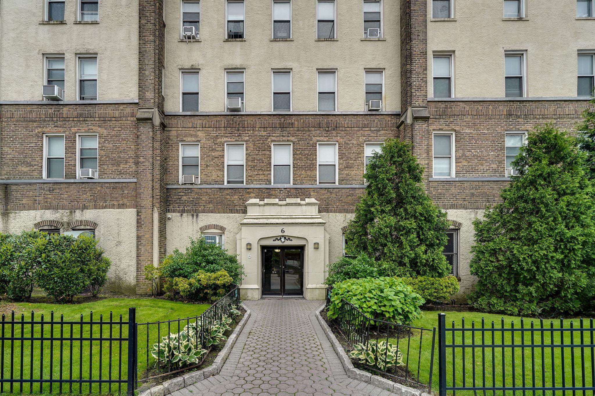 472 Gramatan Avenue, Unit CC3 Mount Vernon, NY 10552 - Photo 3 of 25 front view of a brick house with a yard