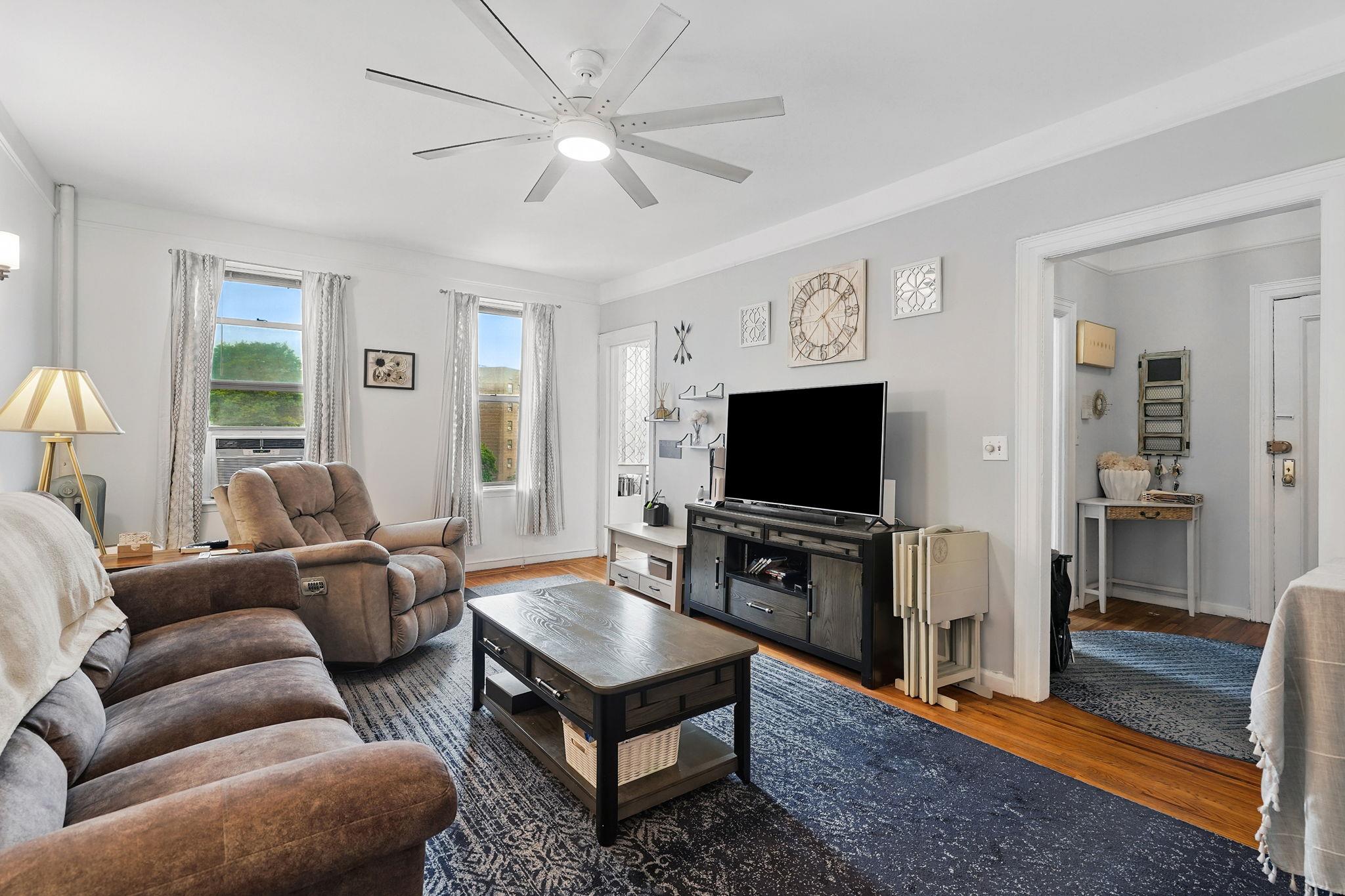 472 Gramatan Avenue, Unit CC3 Mount Vernon, NY 10552 - Photo 7 of 25 a living room with furniture and a flat screen tv