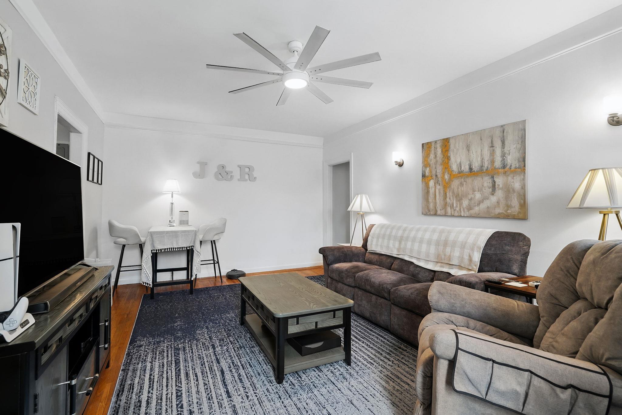 472 Gramatan Avenue, Unit CC3 Mount Vernon, NY 10552 - Photo 8 of 25 a living room with furniture a flat screen tv and a rug