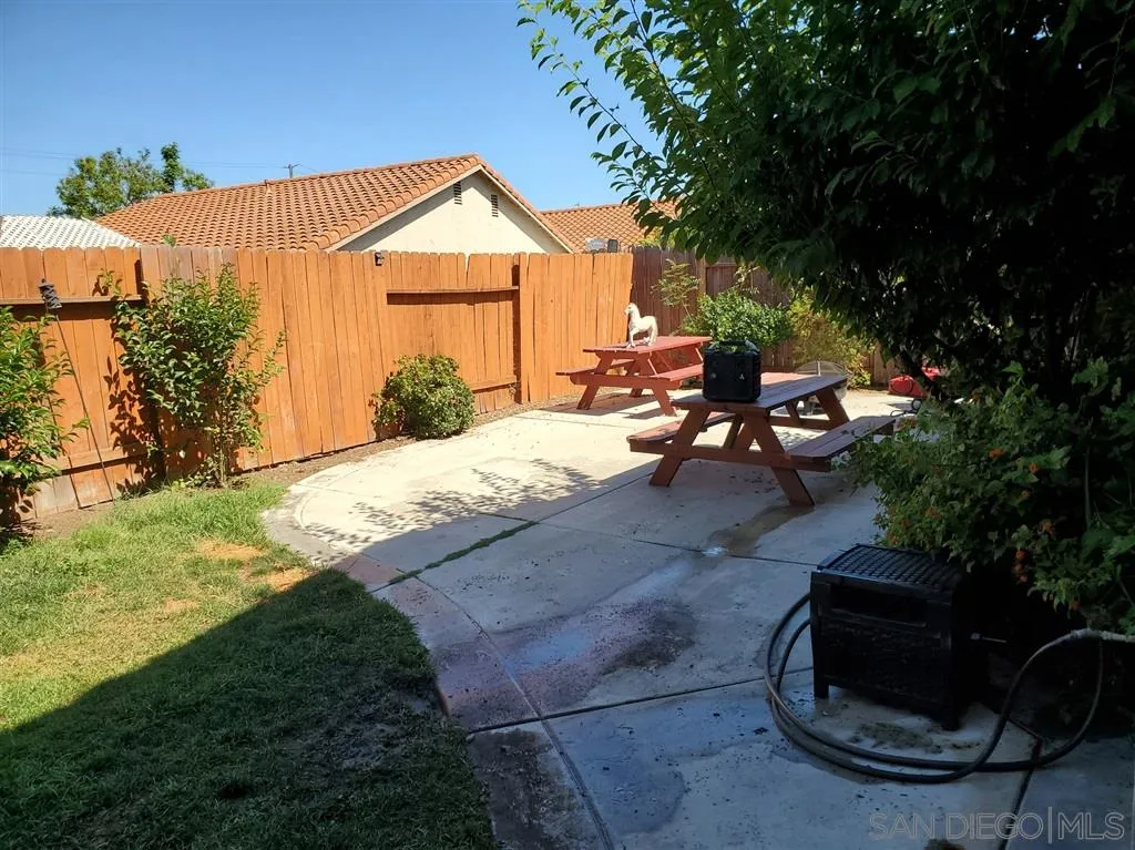 4876 Sumac Place Oceanside, CA 92057 - Photo 14 of 14 a view of a house with backyard and sitting area
