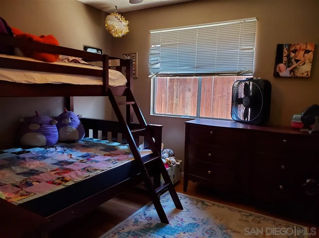 4876 Sumac Place Oceanside, CA 92057 - Photo 10 of 14 a bedroom with a bed and a window