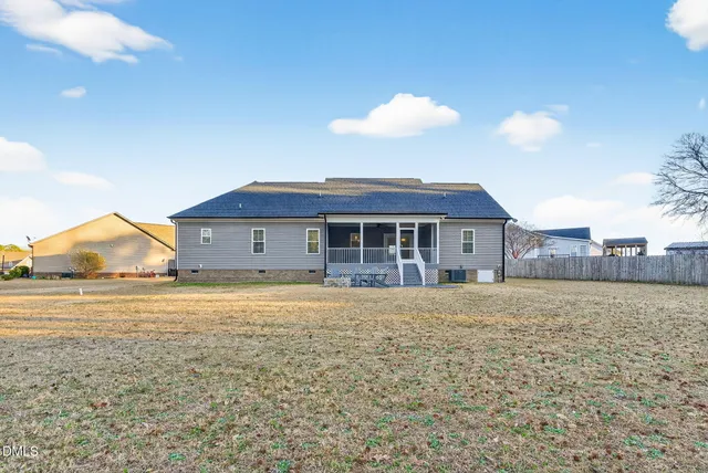 a view of a terrace with chairs and a table